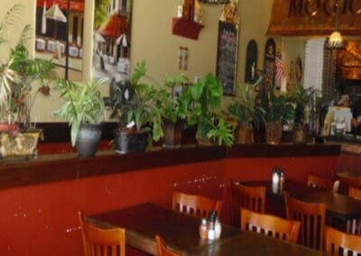 Savor Irresistible Pizza at Mogio's - Discover Inviting Interior in Plano, Texas